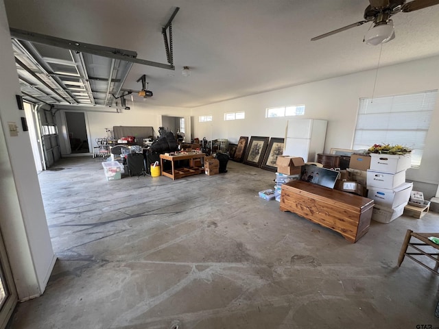 garage with ceiling fan and a garage door opener