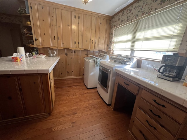 laundry area with light hardwood / wood-style flooring