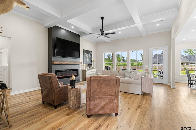 12293 Harlon St, Flint, TX 75762 - living area with ceiling fan, coffered ceiling, light wood-style floors, beam ceiling, and a glass covered fireplace
