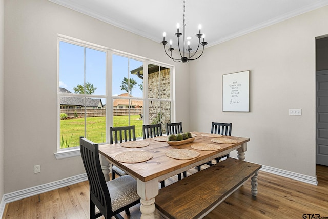 12293 Harlon St, Flint, TX 75762 - dining room with a chandelier, light wood finished floors, and ornamental molding
