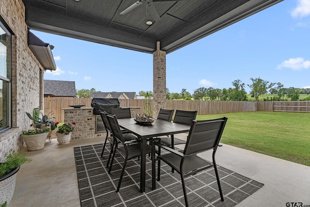 12293 Harlon St, Flint, TX 75762 - fenced backyard featuring outdoor dining space, a ceiling fan, and a patio area