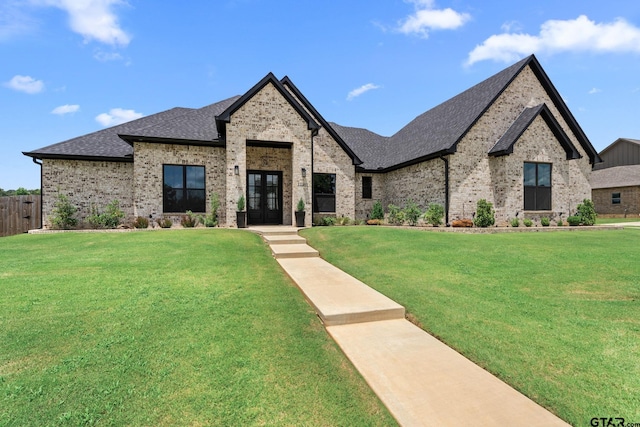 12293 Harlon St, Flint, TX 75762 - french country style house featuring french doors, brick siding, and a shingled roof