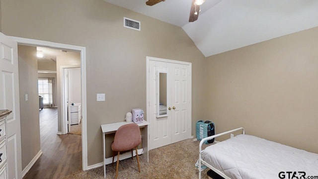 bedroom with lofted ceiling, a ceiling fan, visible vents, and baseboards