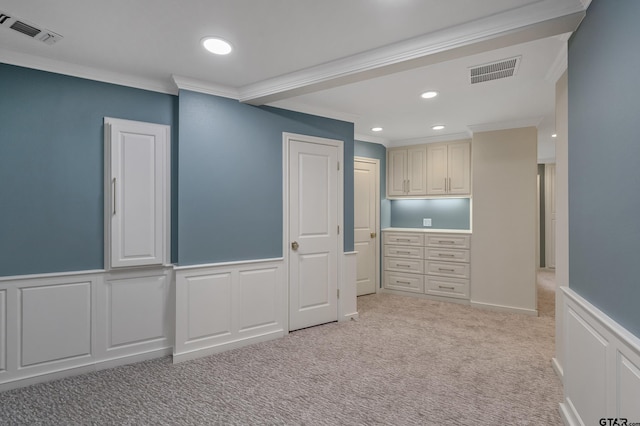 interior space with light carpet, recessed lighting, visible vents, and ornamental molding