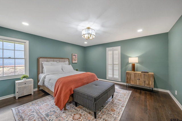 bedroom with recessed lighting, baseboards, a notable chandelier, and hardwood / wood-style floors