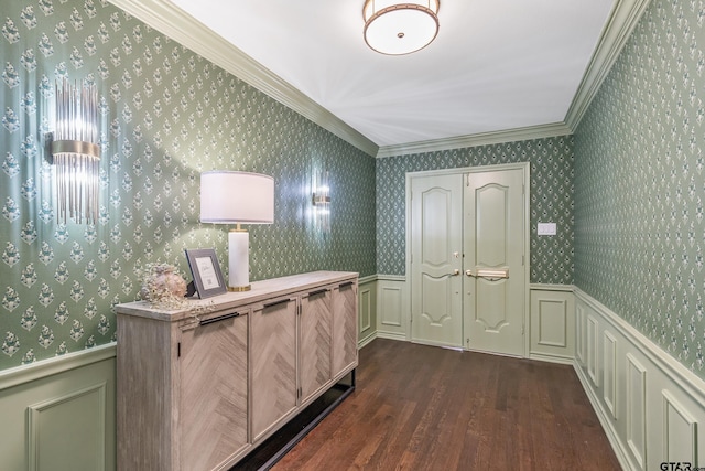 entryway featuring ornamental molding, wainscoting, and wallpapered walls