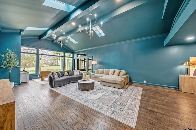 living room with baseboards, lofted ceiling with skylight, wood-type flooring, ornamental molding, and a notable chandelier