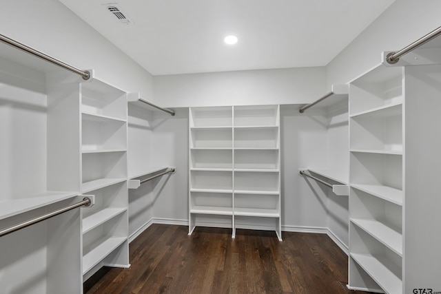 walk in closet featuring visible vents and wood finished floors