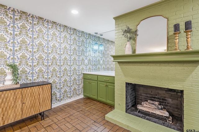 details with wallpapered walls, recessed lighting, a brick fireplace, and baseboards