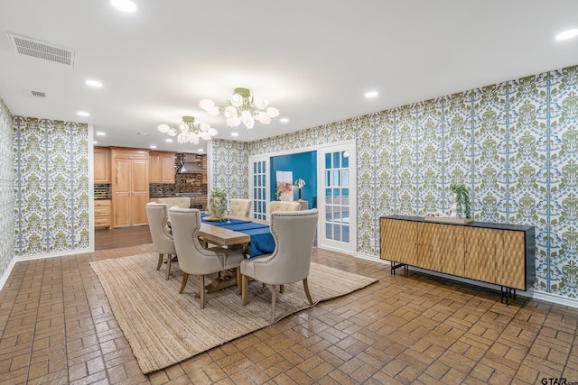 dining area with a notable chandelier, recessed lighting, visible vents, baseboards, and wallpapered walls