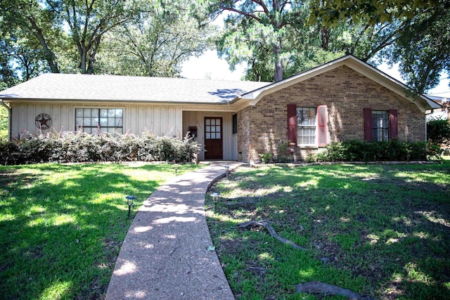3505 Cloverdale Dr, Tyler, TX 75701 - ranch-style house featuring a front lawn, brick siding, and board and batten siding