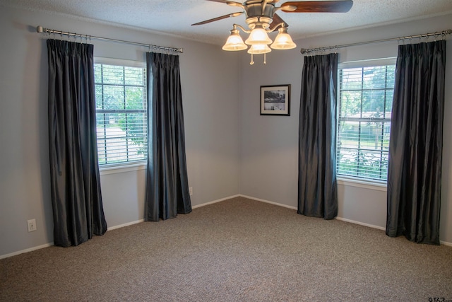3505 Cloverdale Dr, Tyler, TX 75701 - carpeted spare room with a ceiling fan, baseboards, and a textured ceiling