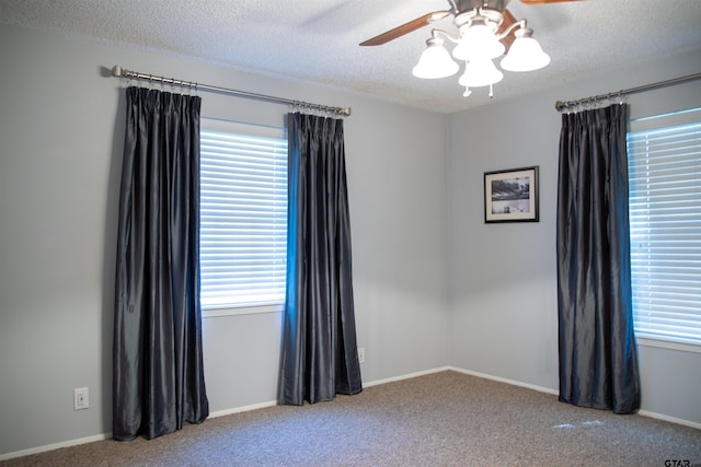 3505 Cloverdale Dr, Tyler, TX 75701 - carpeted empty room with a ceiling fan, healthy amount of natural light, a textured ceiling, and baseboards