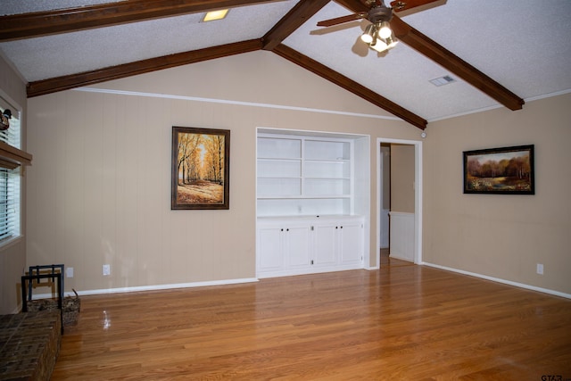 3505 Cloverdale Dr, Tyler, TX 75701 - unfurnished living room featuring wood finished floors, ceiling fan, built in shelves, and baseboards