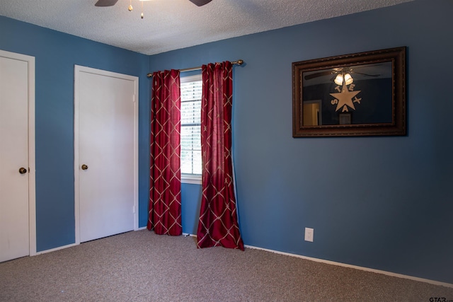 3505 Cloverdale Dr, Tyler, TX 75701 - unfurnished bedroom featuring carpet, a textured ceiling, and ceiling fan