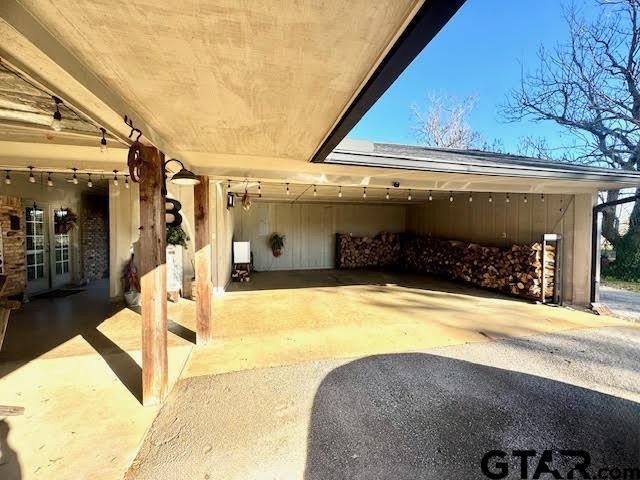 12239 Lovers Ln, Larue, TX 75770 - view of patio / terrace featuring driveway and french doors