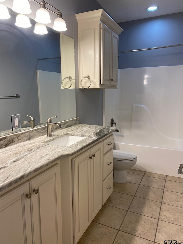 full bathroom featuring tile patterned flooring, vanity, toilet, and tub / shower combination