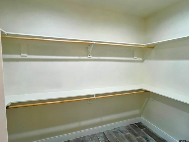225 S Quille Ave, Mount Pleasant, TX 75455 - walk in closet with dark wood-type flooring