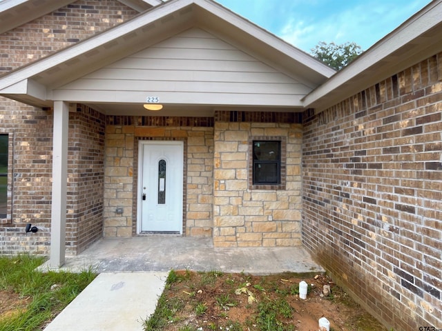 225 S Quille Ave, Mount Pleasant, TX 75455 - property entrance featuring brick siding and elevator