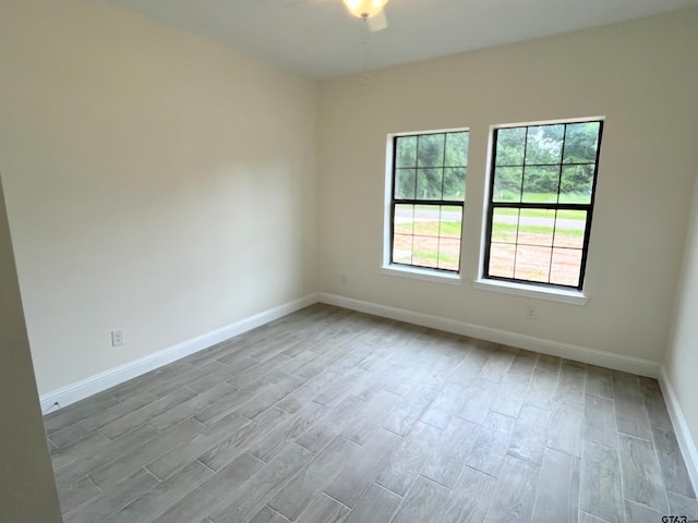 225 S Quille Ave, Mount Pleasant, TX 75455 - spare room with wood finished floors and baseboards