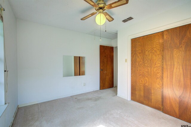 19870 Fm 1253, Lindale, TX 75771 - unfurnished bedroom with attic access, carpet floors, a closet, and ceiling fan