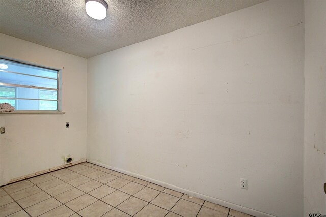 19870 Fm 1253, Lindale, TX 75771 - unfurnished room featuring a textured ceiling and light tile patterned flooring