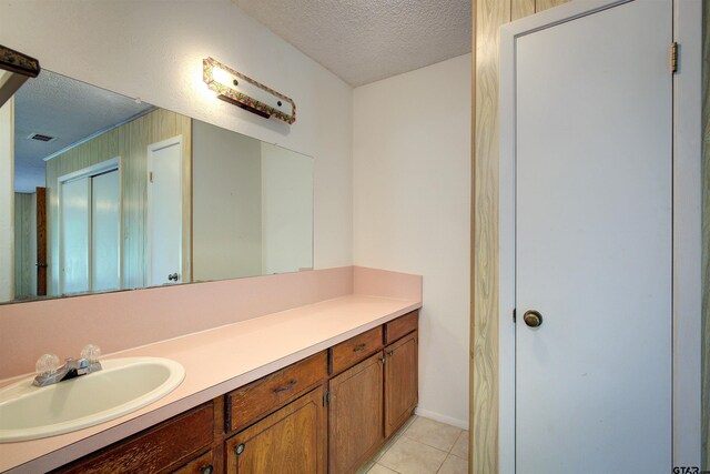 19870 Fm 1253, Lindale, TX 75771 - bathroom with a textured ceiling, vanity, and tile patterned flooring