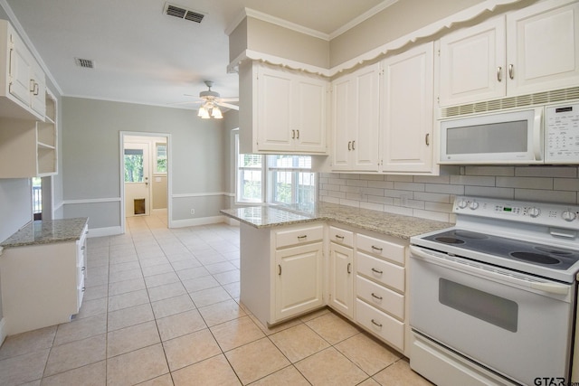 kitchen featuring kitchen peninsula, white appliances, decorative backsplash, and light tile patterned floors