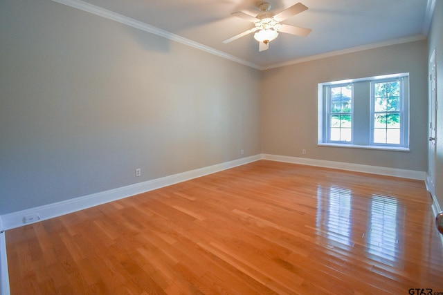 empty room featuring light hardwood / wood-style flooring, ceiling fan, and crown molding