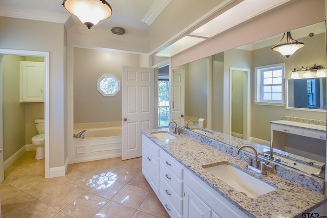 bathroom with a bathtub, tile patterned floors, ornamental molding, vanity, and toilet