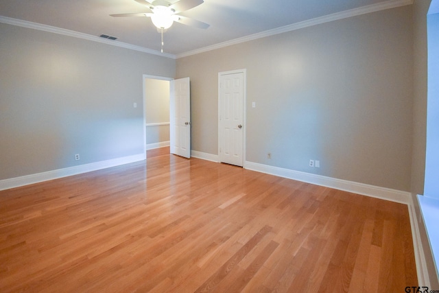 spare room with light hardwood / wood-style flooring, ceiling fan, and crown molding