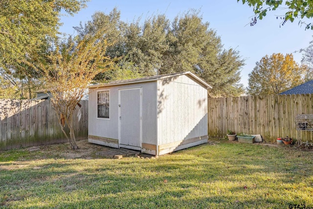 view of outbuilding featuring a lawn