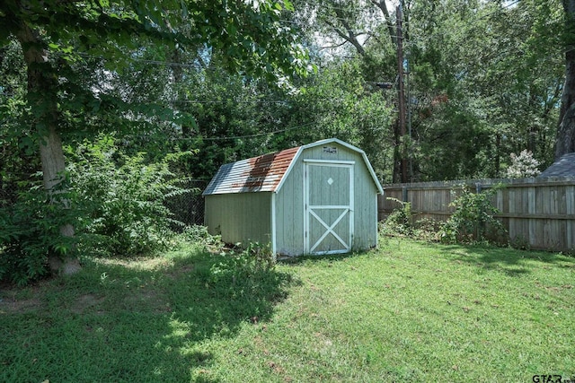 view of shed with fence