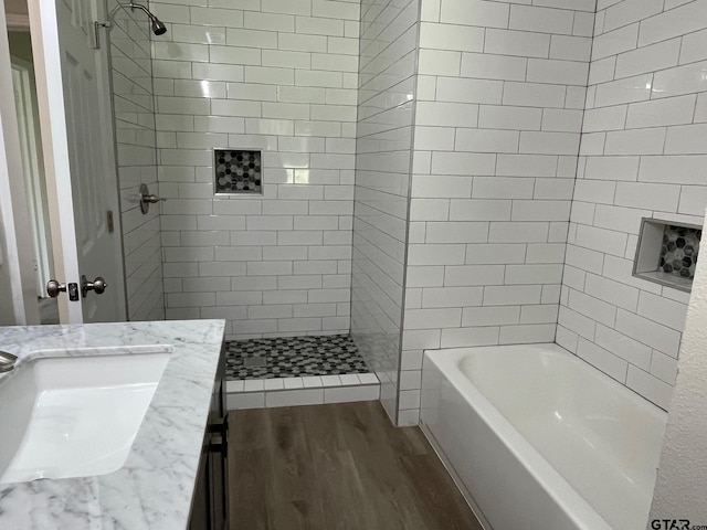 bathroom featuring hardwood / wood-style flooring and vanity