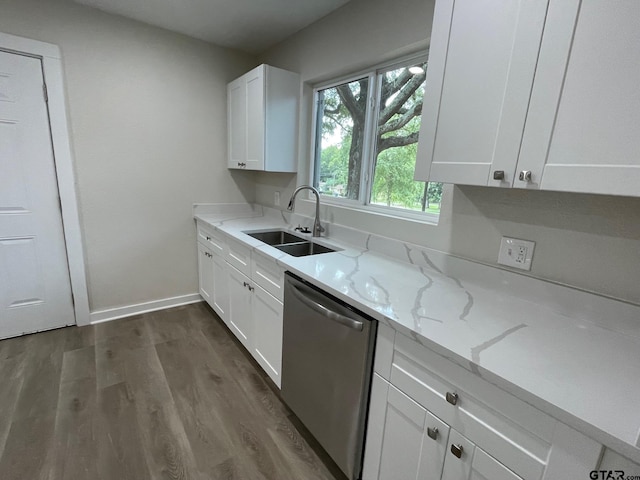 kitchen with sink, light stone countertops, stainless steel dishwasher, white cabinets, and dark hardwood / wood-style flooring