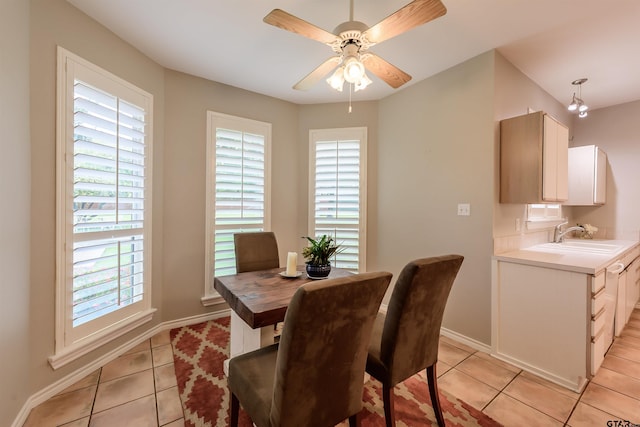 10074 Hillside Ln, Flint, TX 75762 - dining space with light tile patterned floors, plenty of natural light, a ceiling fan, and baseboards