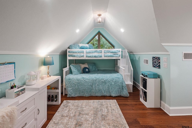 1940 Stonehill Dr, Tyler, TX 75703 - bedroom with dark wood-style floors and vaulted ceiling