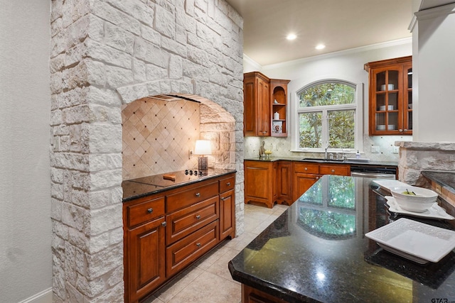 1940 Stonehill Dr, Tyler, TX 75703 - kitchen featuring tasteful backsplash, light tile patterned floors, dark stone counters, brown cabinetry, and open shelves