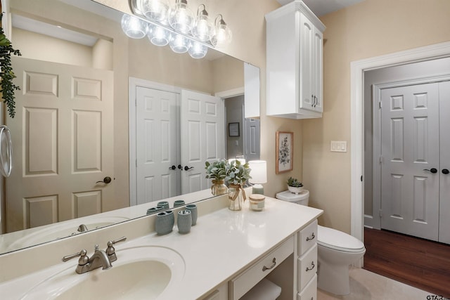 1940 Stonehill Dr, Tyler, TX 75703 - bathroom featuring vanity and wood finished floors