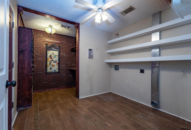 washroom featuring ceiling fan, dark hardwood / wood-style floors, a textured ceiling, electric dryer hookup, and hookup for a washing machine