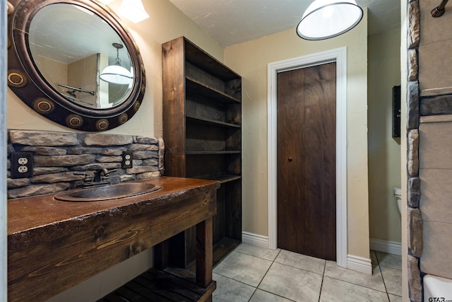 bathroom featuring tile patterned floors and sink