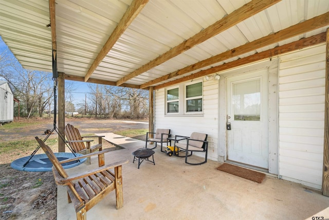 view of patio / terrace featuring a fire pit