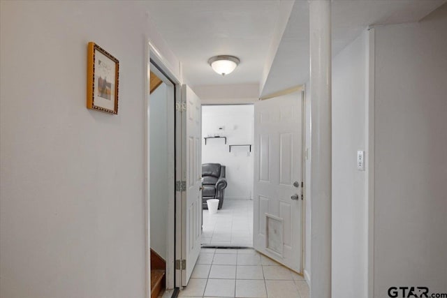 hallway featuring light tile patterned flooring