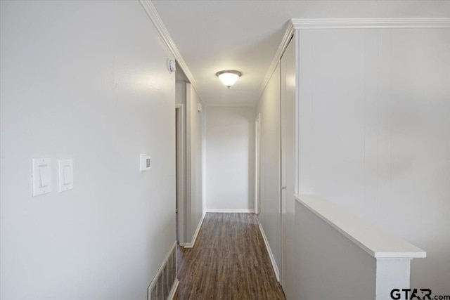 corridor featuring ornamental molding and wood-type flooring