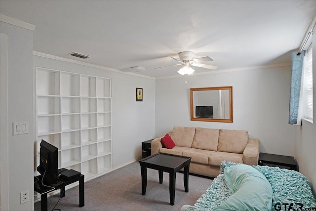 carpeted living room with ceiling fan and ornamental molding