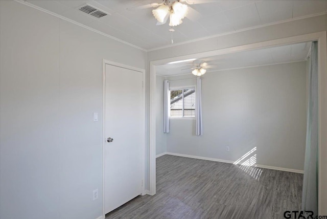 spare room with ornamental molding, hardwood / wood-style floors, and ceiling fan