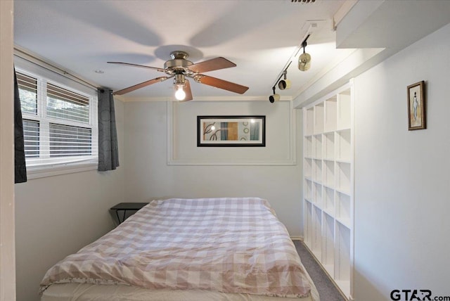 bedroom featuring ornamental molding and ceiling fan