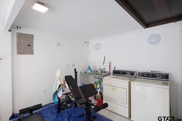 laundry area with washer and clothes dryer, electric panel, sink, and crown molding