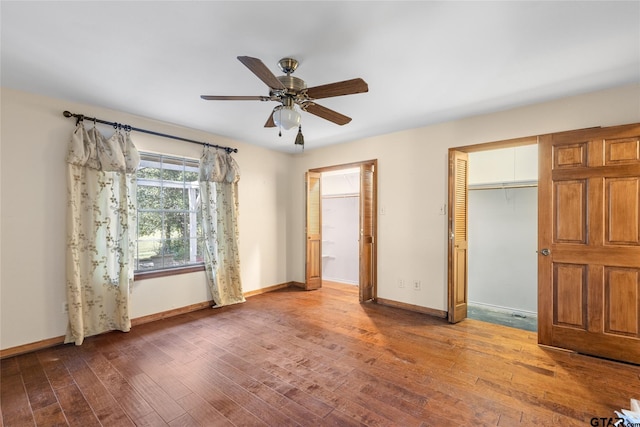 unfurnished bedroom featuring ceiling fan and hardwood / wood-style flooring