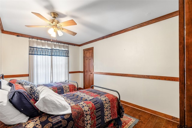 bedroom featuring ceiling fan, dark hardwood / wood-style floors, and crown molding